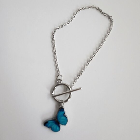 NWOT Silver tone bracelet with blue butterfly pendant and toggle clasp - Picture 2 of 6
